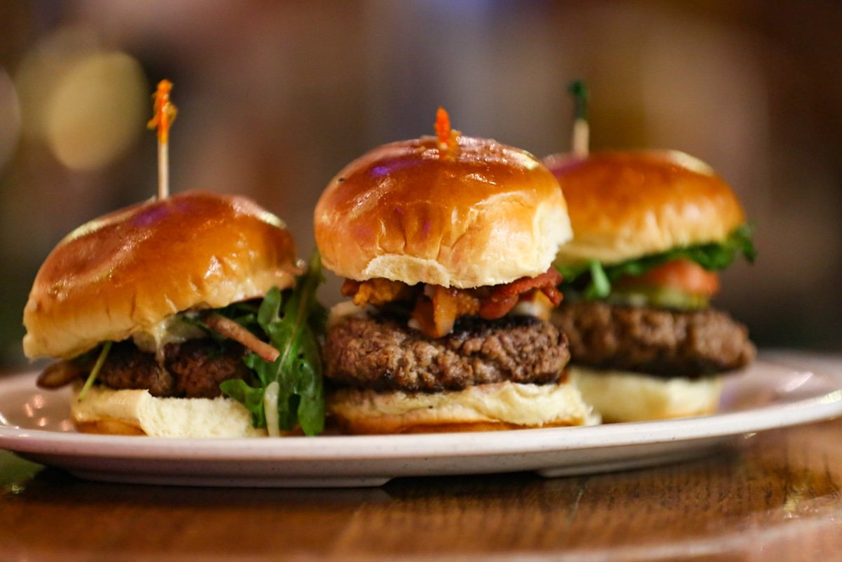 This is the Slider Flight Trio from  #OtoolesThe Classic - Lettuce, tomato, onion and American cheeseThe Smokehouse - Crispy onion rings, bbq sauce & cheddar cheeseO'toole's Burger - Irish white cheddar cheese, roma tomatoes, shaved onion, arugula and roasted garlic aioli 