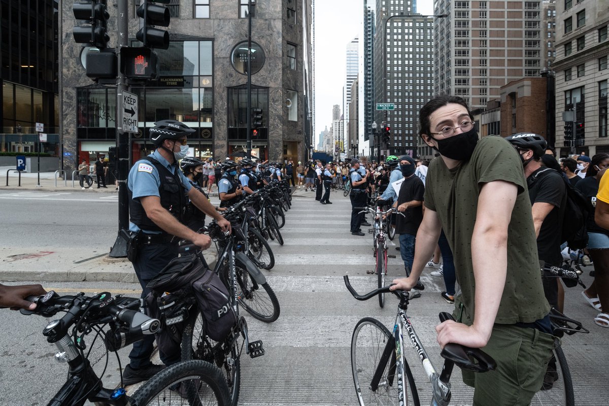 At Michigan and Wacker, there was a police presence immediately to the east, and also half a block to the west. Bike marshals set up a bike line to the east to protect the group, and police set up a bike line opposite them.
