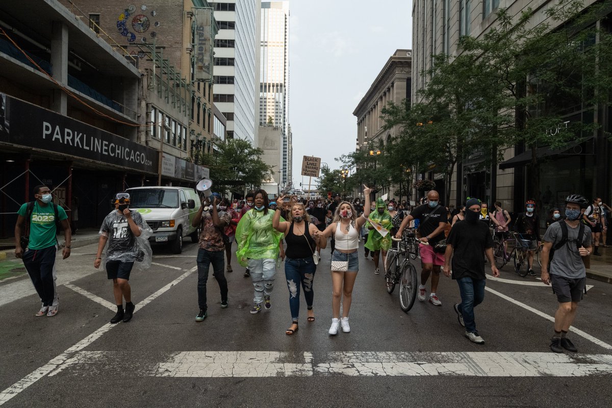 After a pause at Michigan and Randolph, we headed west, followed by the cops. I started to feel claustrophobic, because bike cops were sent ahead on either side of the crowd, leaving only the path west. Raised bridges, and bike cops blocking streets in the distance.