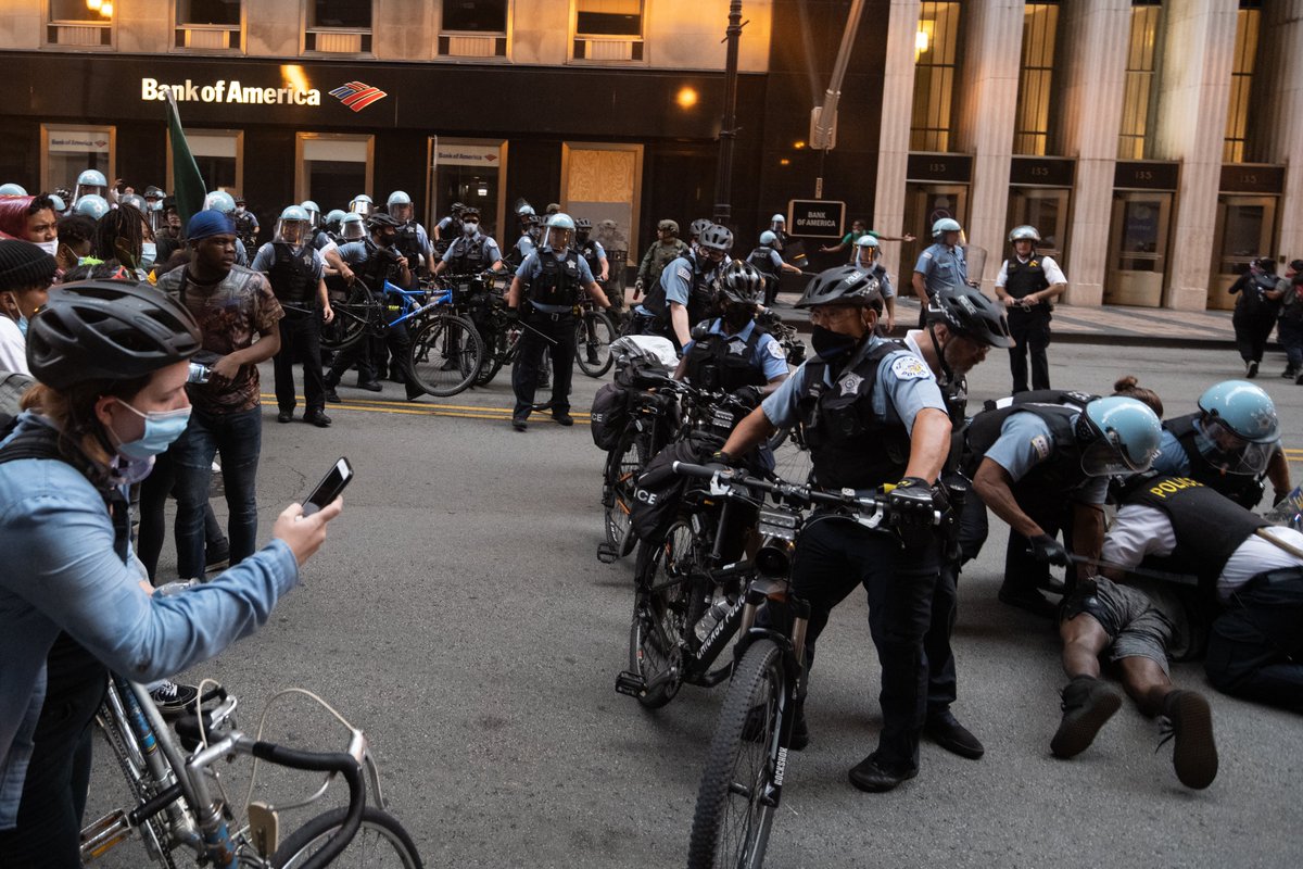 One man was beaten and arrested right in front of me. Also notice the rubber bullet on the ground. I didn't see or hear it fired.