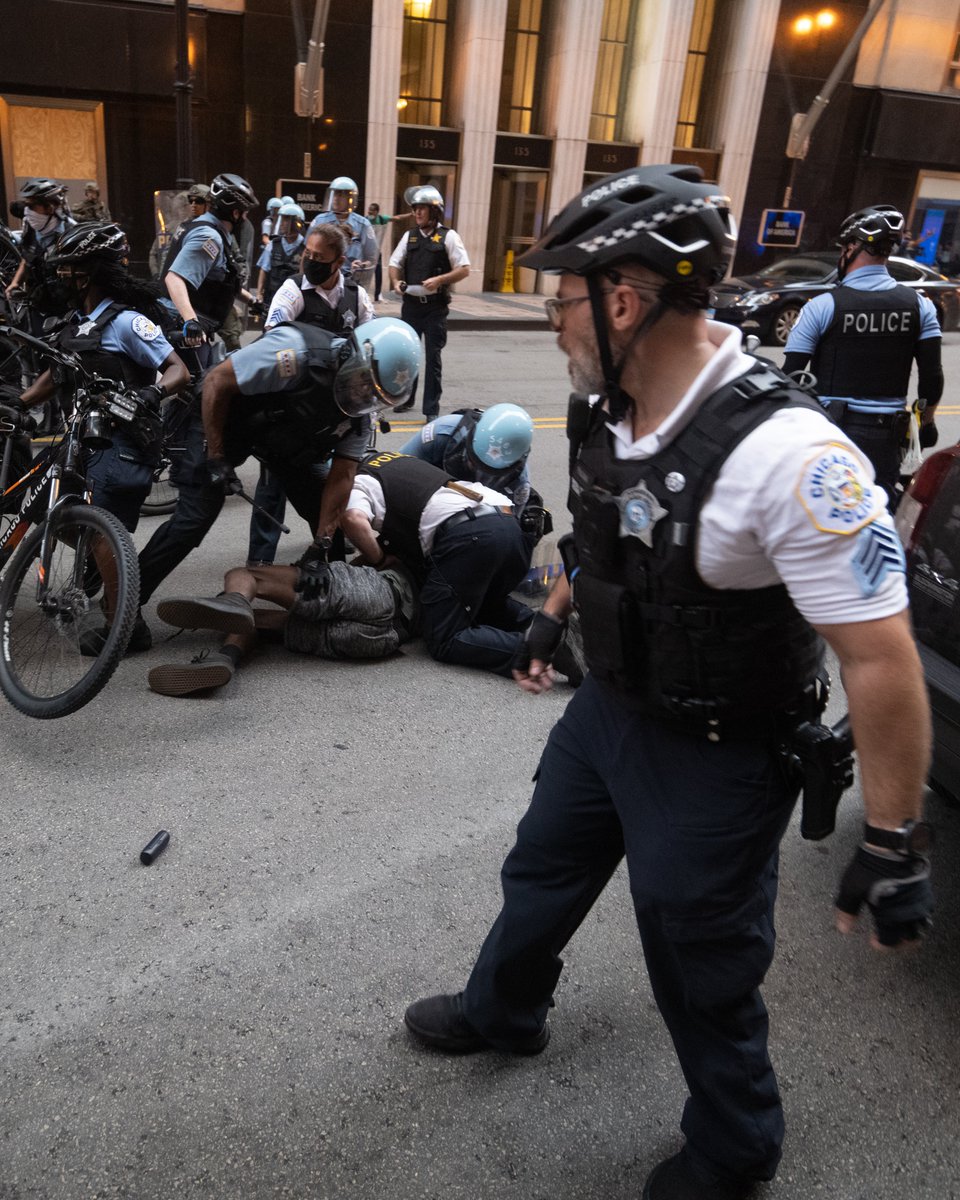 One man was beaten and arrested right in front of me. Also notice the rubber bullet on the ground. I didn't see or hear it fired.