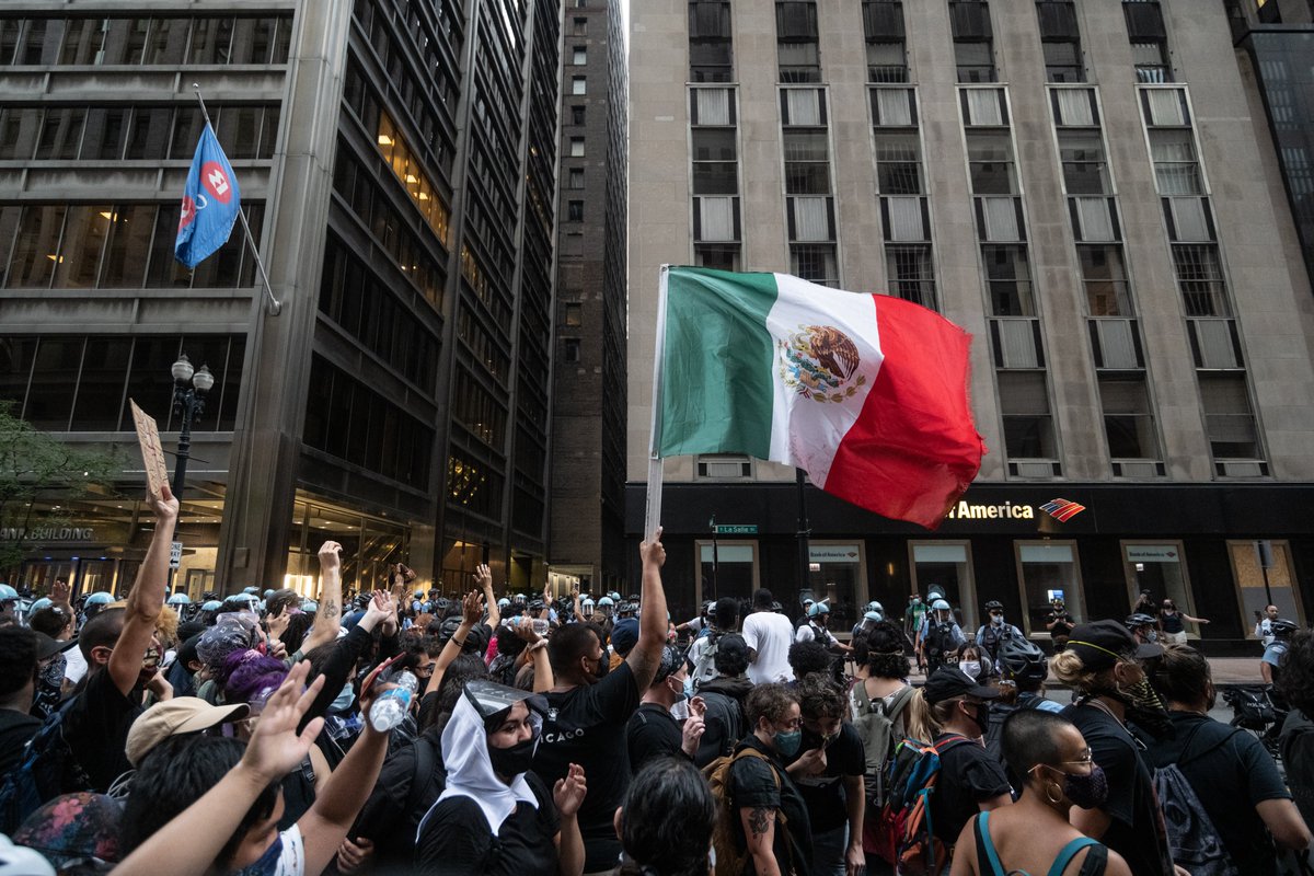 Lines of police with bikes or shields held our group tightly on all sides against a building. This is called kettling. Some people were still incapacitated from the pepper spray.