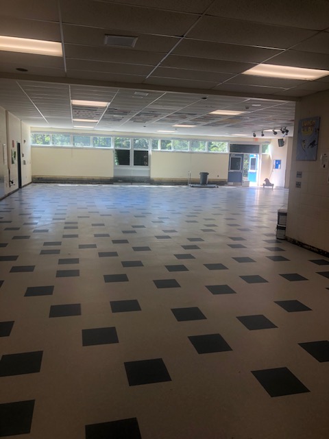 QuashnetAP's tweet photo. The "Yellow" Hallway and the Cafeteria getting a nice new floor. Can't wait to have our Falcons back. https://t.co/FEEdTiVRtq
