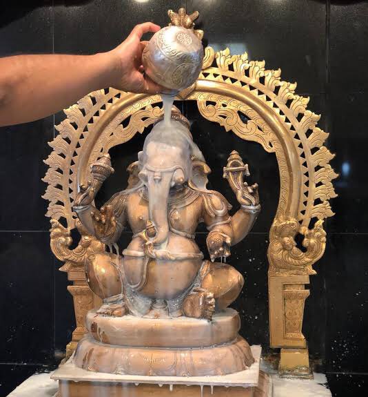 Abhishekam - giving a bath to the God ! Water, milk, curd, butter, sugar, ghee and honey ! Followed by application of Sandalpaste.