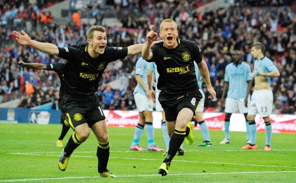 Wigan score a dramatic last minute winner to steal the 2013 FA Cup final away from Manchester City. Wigan were relegated from the Premier League the same season.
