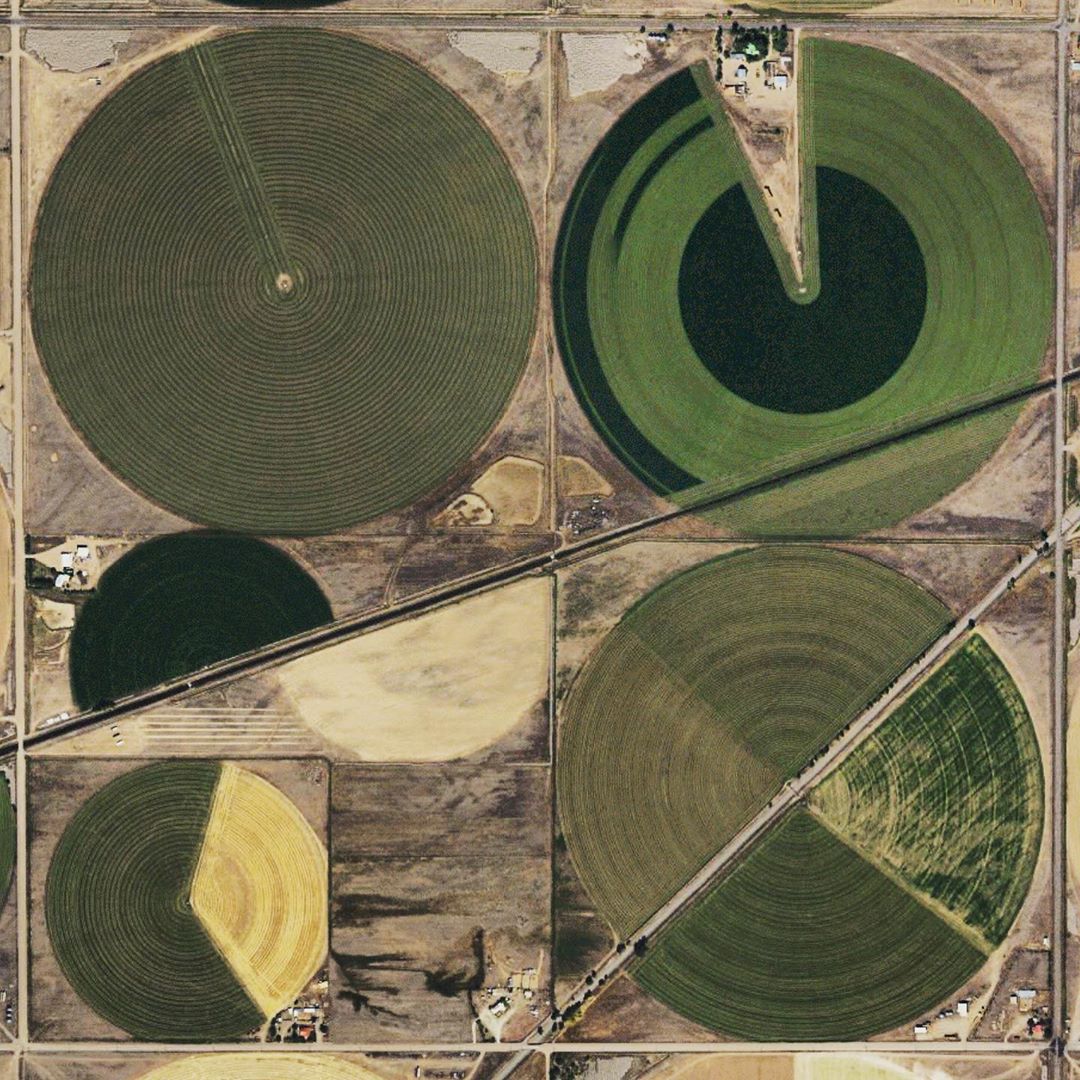 Architect Ronald Rael has launched an Instagram account documenting center-pivot irrigation landscapes around the world—what he calls “dots of life when seen from space.” Some beautiful and surreal examples, like graphic design crossed with terraforming. instagram.com/centerpivotspr…