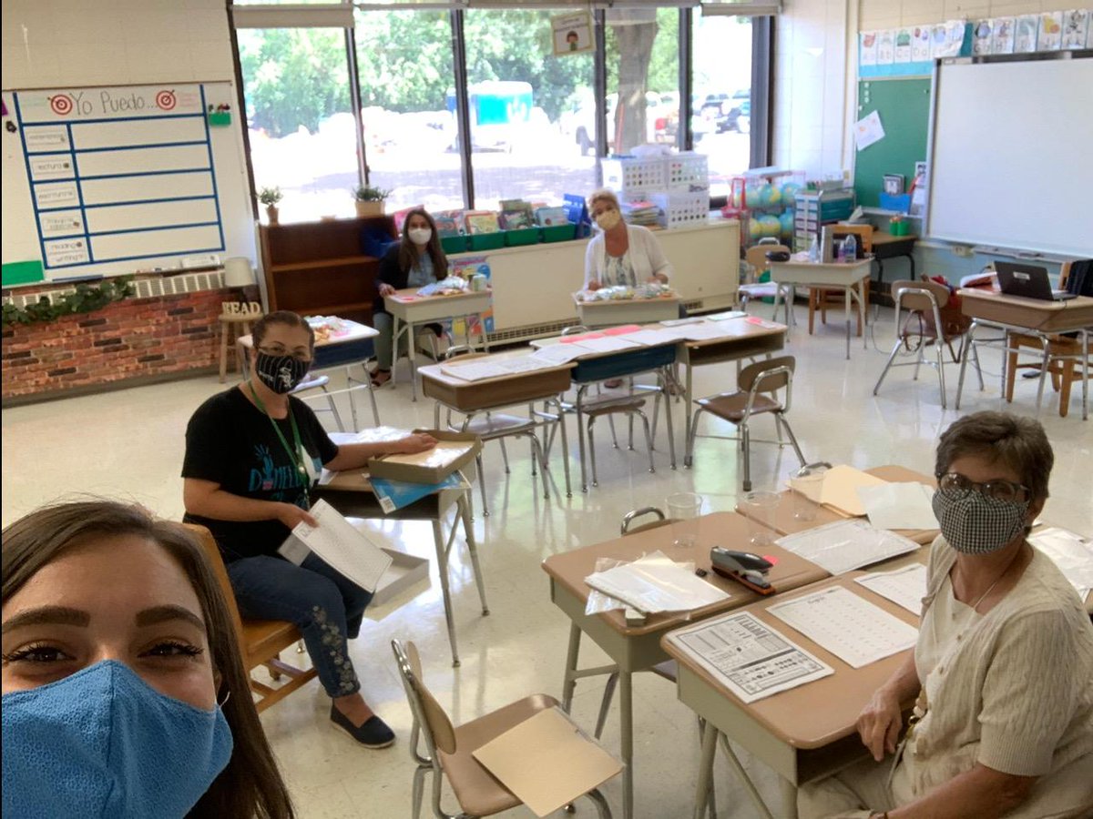 Our dedicated and hardworking #D205teachers putting together learning packets with materials to send home with students!  #Committed #teamwork #remotelearning