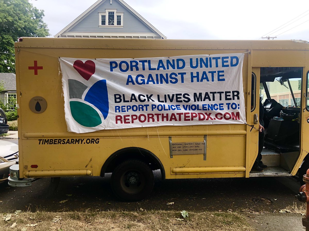 A yellow van is here from Portland United Against Hate, a local nonprofit that facilitates anonymous reporting of police violence and hate crimes ( http://reporthatepdx.com ). While not a medic van, the van is offering first aid supplies to anyone who needs them.