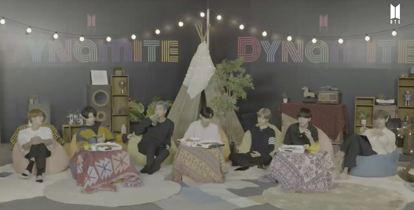 do not be out here calling what you see in the background a tent and downplaying it. this is obviously a structure made to resemble a tipi, the poles sticking out at the top are a dead give away to me and many other natives not only on army stan twitter but twitter in general.