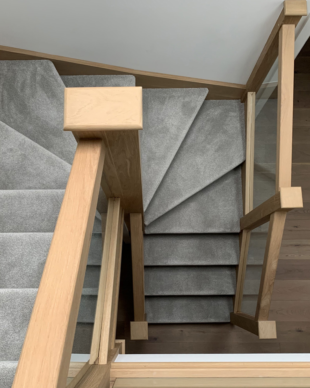 Pear Stairs on X This double winder oakstaircase features sleek minimalist glassbalustrades that really help capitalise on the light coming from the sky lights. Start designing your own bespoke stairc...