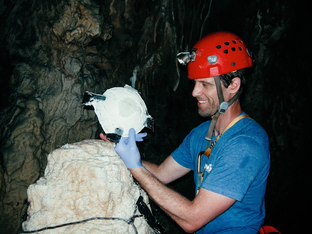 Lead author Michael Griffiths (@mickgriff02), former @NOAA Climate and Global Change postdoc @uciess and Associate Professor at William Paterson University, collects a sample of calcite growth that precipitated onto a glass plate left in Tham Doun Mai cave, Laos for two years.