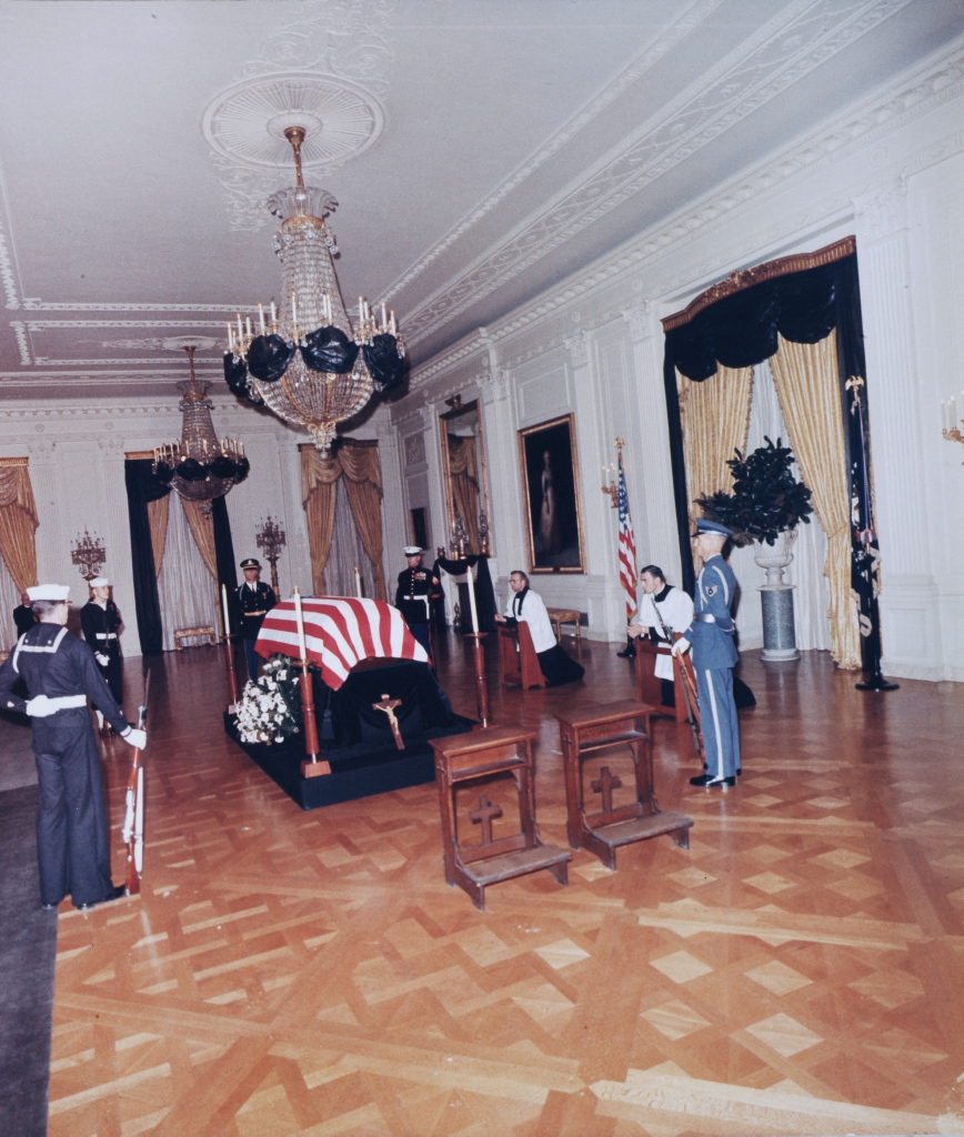 This photograph shows the remains of President John F. Kennedy lying in state in the East Room of the White House following his assassination in 1963. The casket is surrounded by an honor guard and two priests. 8/8Image: John F. Kennedy Presidential Library and Museum / NARA