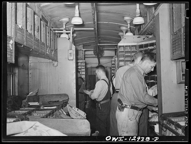 This is by the celebrated photographer Arthur Rothstein, a Farm Security Administration shot showing mail sorting on a railroad car. (Credit: Library of Congress, Prints & Photographs Division, Farm Security Administration/Office of War Information Black-and-White Negatives.)