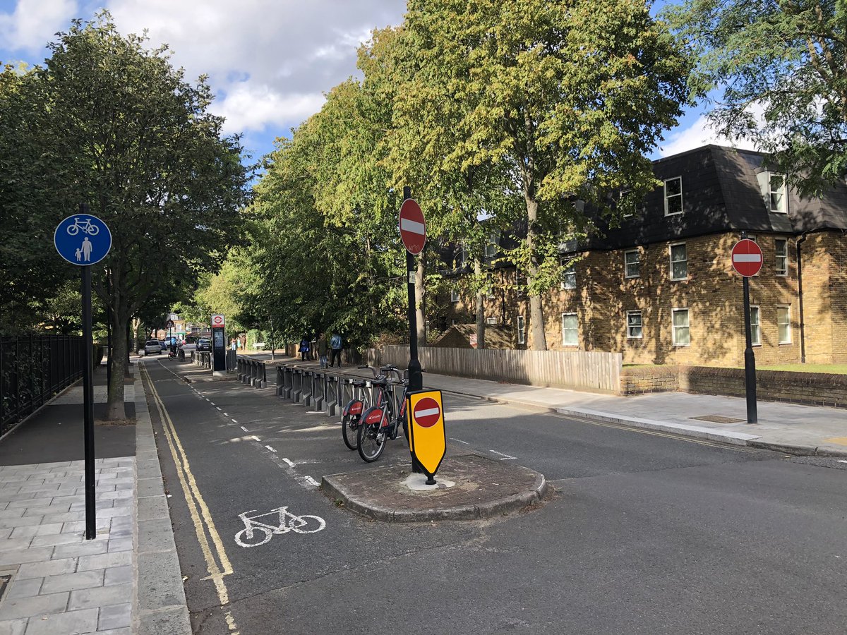 This isn’t new but nicely done in Stockwell - a contraflow cycle lane on a street that’s one-way for motor traffic, with a rank of Boris bike docks used for protection