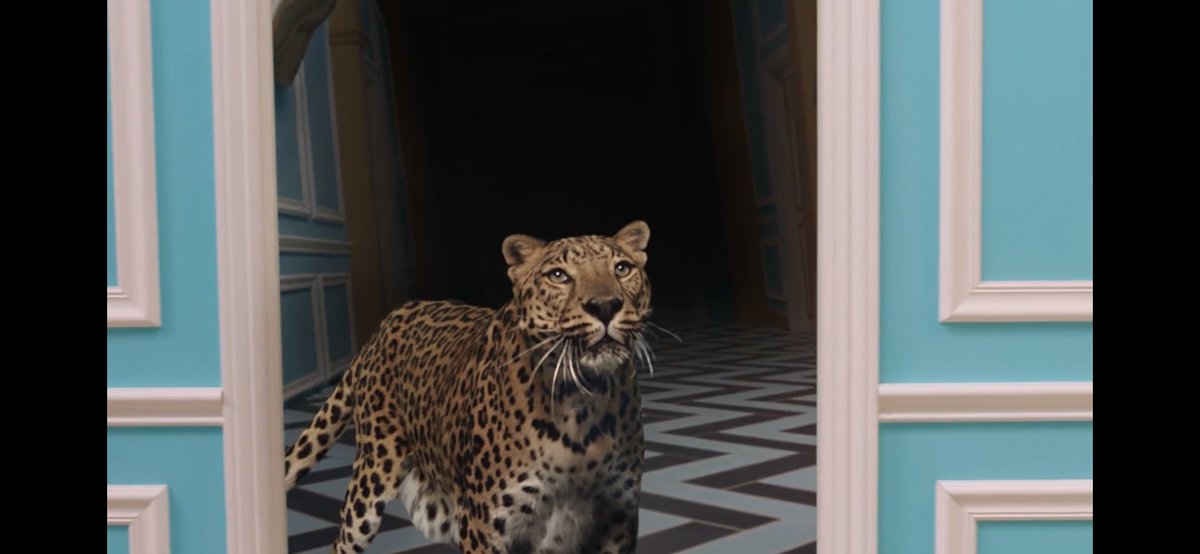 (3) She passes by a room/corridor with a leopard in it, and you can briefly see a lightning bolt behind it. Metaphor for the beta kitten electric shock programming happening in the mansion/mind