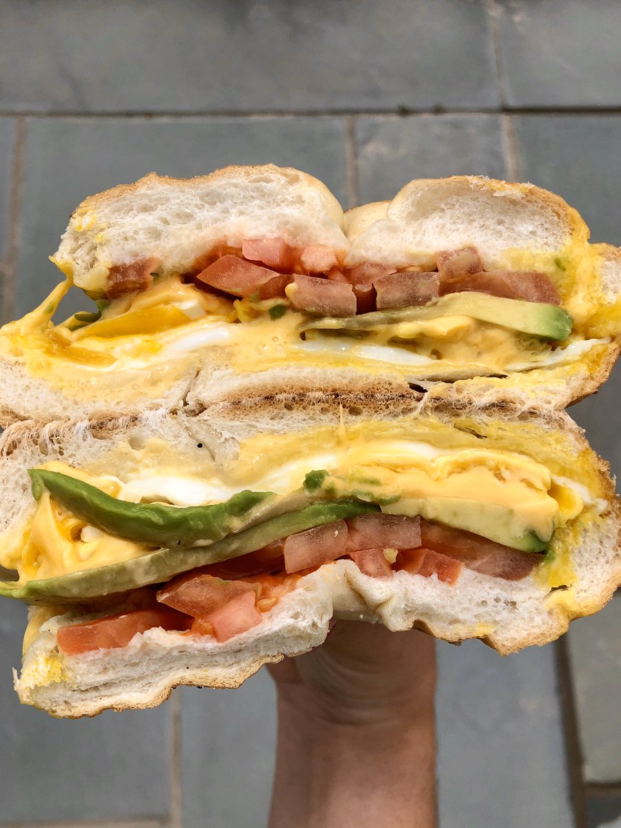 TastyTabletop's tweet photo. Egg + Cheese + Avo + Tomato on a Roll • Baymen’s Deli • Hampton Bays https://t.co/QhUBKGsRFd
