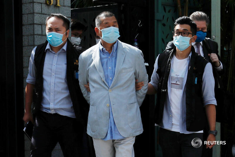 Reuters's tweet photo. Hong Kong media tycoon Jimmy Lai became the highest-profile arrest under a new national security law, detained over suspected collusion with foreign forces as scores of police searched the offices of his Apple Daily newspaper https://t.co/wxD9kXWw3l https://t.co/H5TtXDul5L