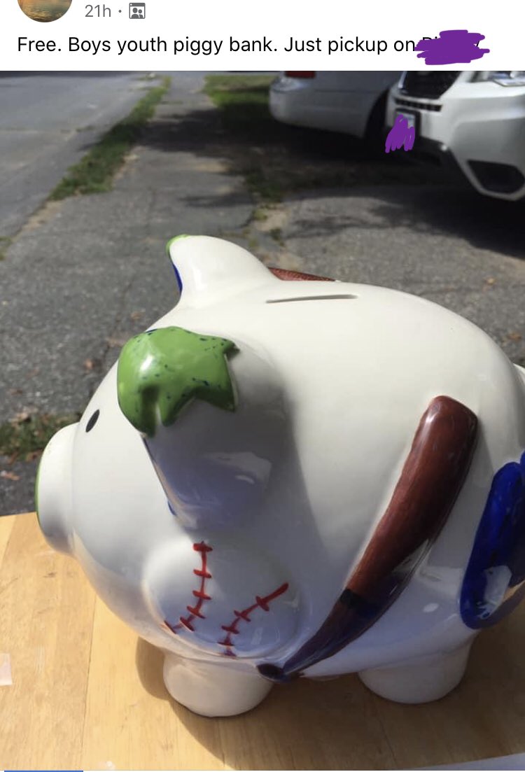 Ceramic piggy bank with baseball and bat on it