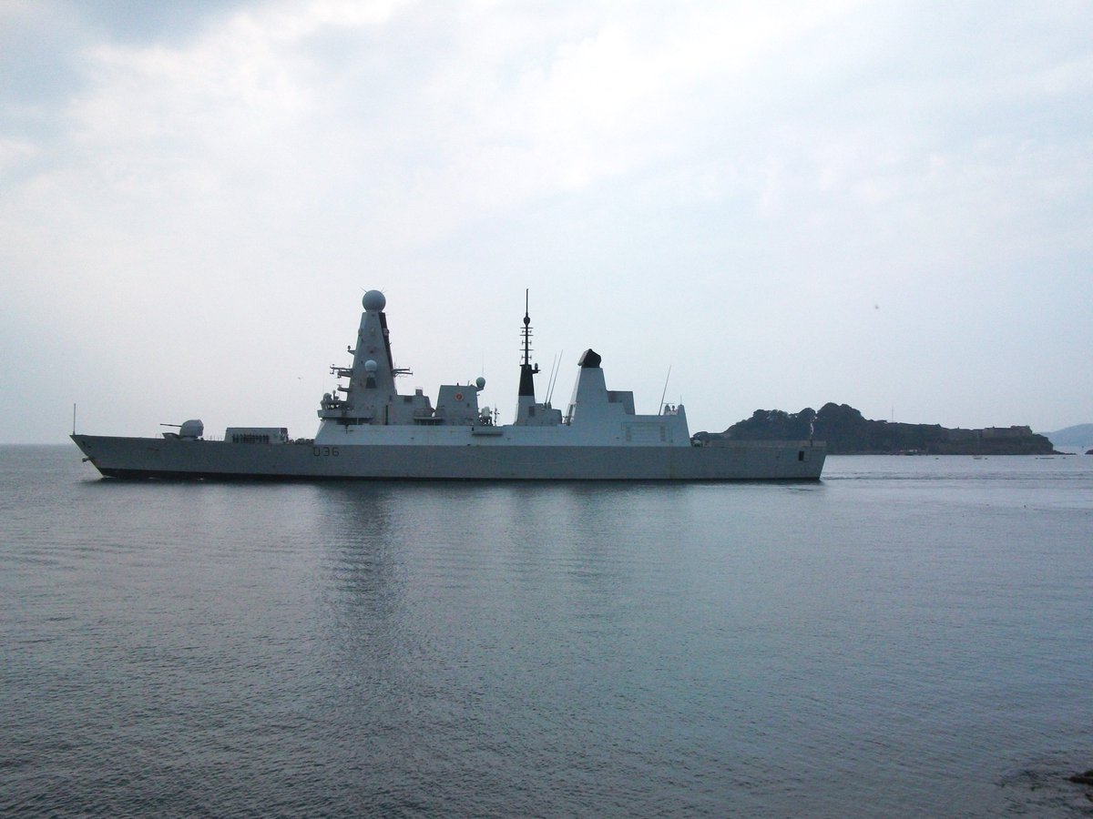 PlymouthDevon1's tweet photo. HMS Defender outbound from a hazy Devonport Plymouth this morning, accompanied by tugs SD Careful &amp; SD Adept. @HMSDefender @PlymouthDevon1 @NavyLookout @SercoGroup @RachelHWing @ArmouredCarrier @AC_NavalHistory @johnmorgan726 @TheBrit96 #tuglife #tugboats #SDAdept #SDCareful https://t.co/6XUACW2SzQ