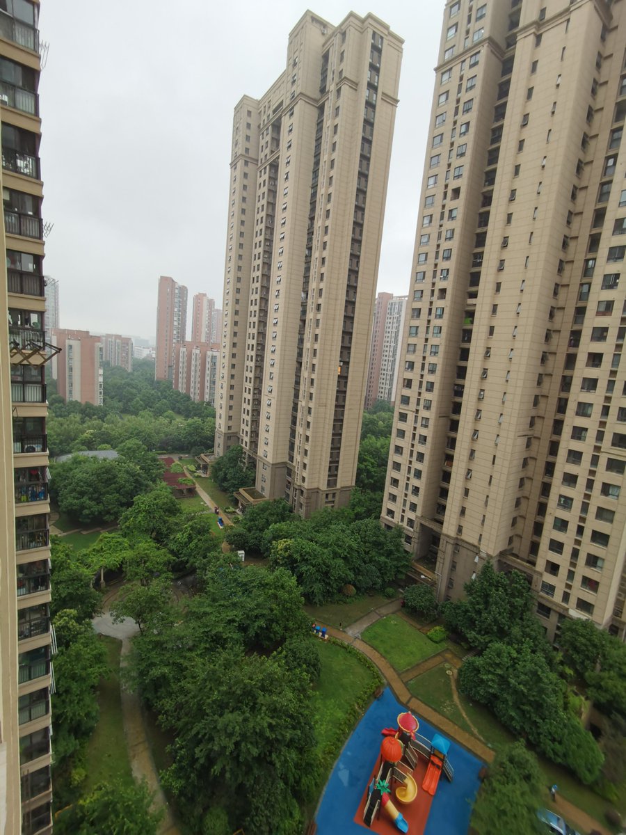 24 — Nearly all Chinese live in compounds, or 'small-districts', fenced-off areas. This one is a big one, and has ~30 buildings ranging from 16-24 floors, with playgrounds and greenery in between and a parking garage underground.