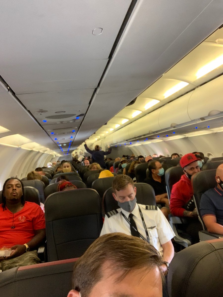 therealtayfelt's tweet photo. Ummmmm. Well someone’s getting  Rona on this flight. Should have flown Delta. @delta @AmericanAir https://t.co/CU67jLZWc4