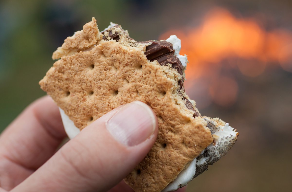 Our favorite way to cook s'mores is outside over a campfire, what is yours? #NationalSmoresDay