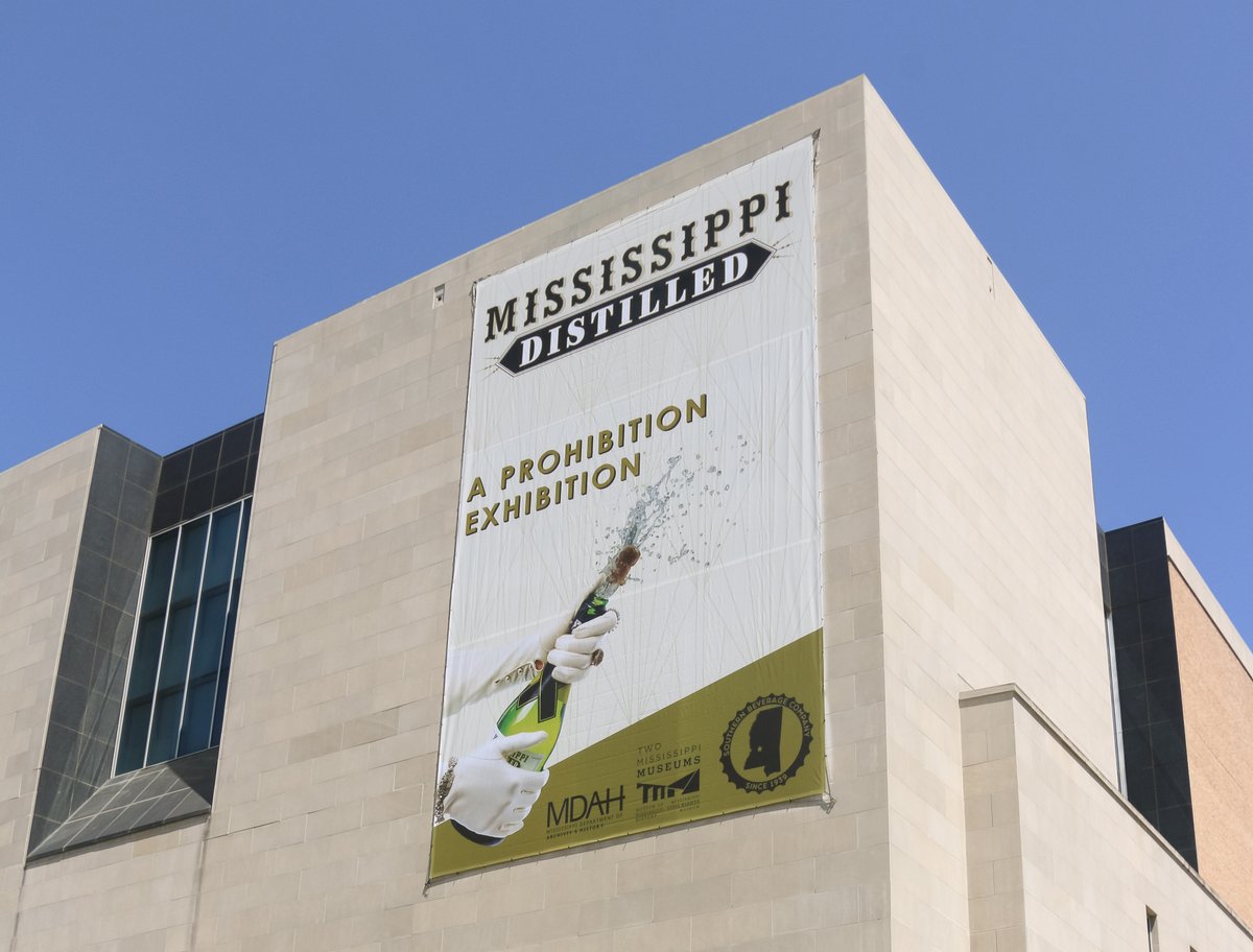 A new banner at the museums advertises Mississippi Distilled: Prohibition, Piety, and Politics, an immersive exhibition exploring the state’s tumultuous relationship with alcohol from the colonial period to today. 

Have you seen it? Learn more at mmh.mdah.ms.gov/mississippi-di….