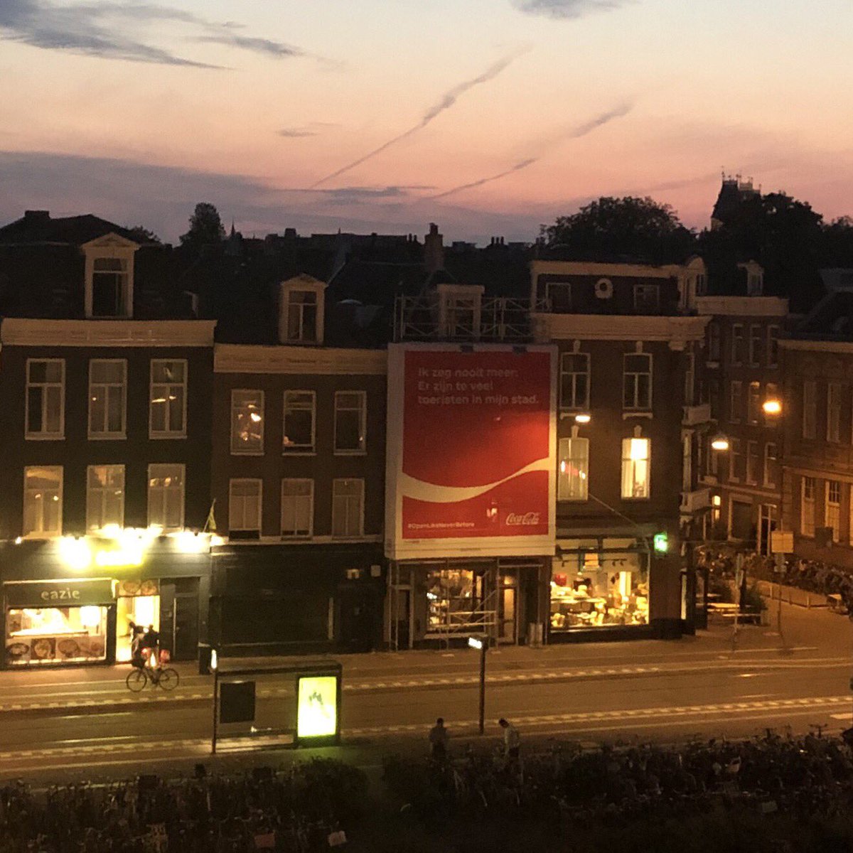 Jaap_Kooijman's tweet photo. There is a big @CocaCola sign on the Amsterdam Marie Heinekenplein saying (in Dutch) “I’ll never again will say: There are too many tourists in my city.” Welll... actually I am surprised how many there are already. @BvdPijp @AmsterdamNL https://t.co/F6E47gsOW0