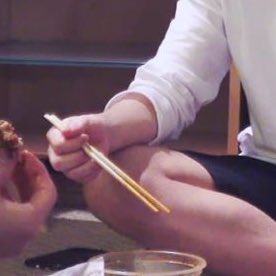 When he holds the chopsticks