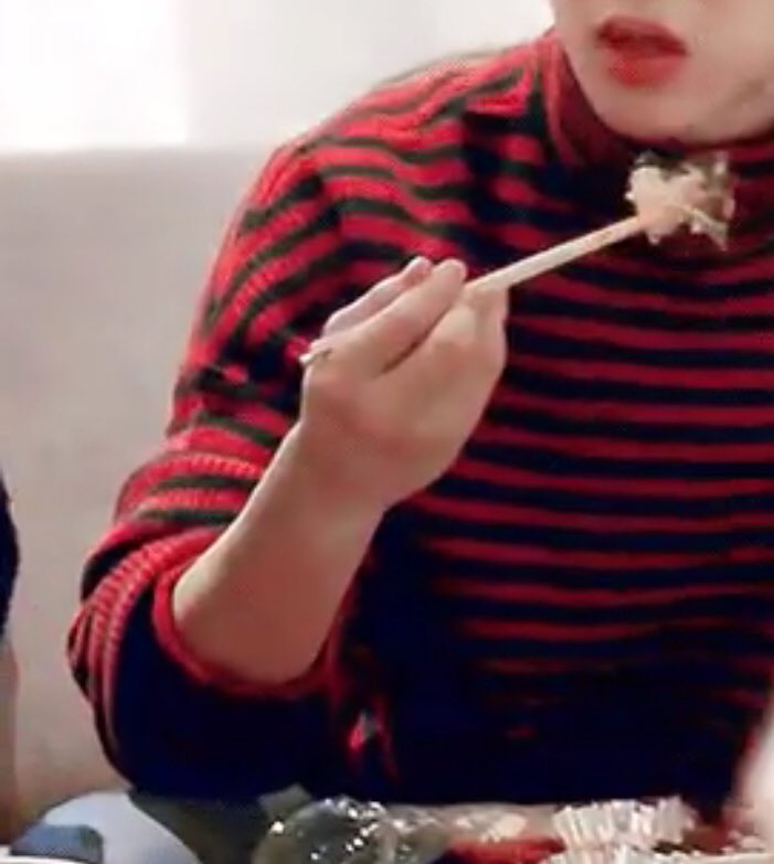 When he holds the chopsticks