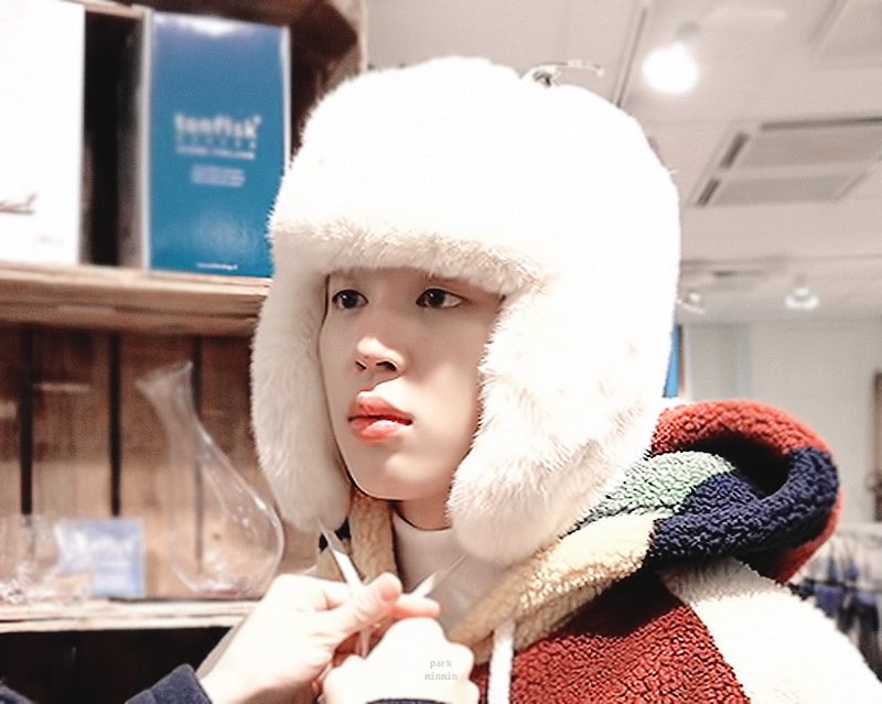 With his fluffy hat