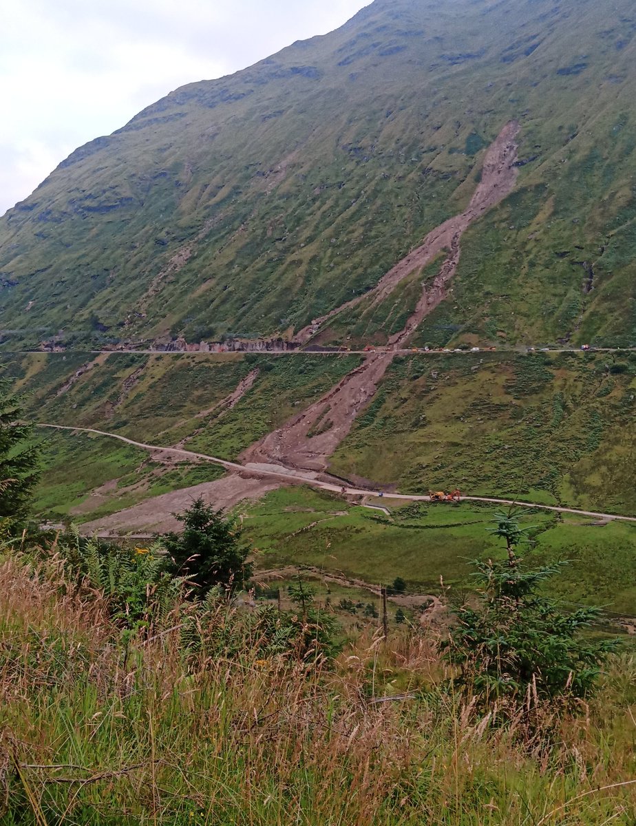 isawthewood's tweet photo. How many *years/decades/centuries/millenia (*select as appropriate) for a planting scheme to stabilise this slope and make the road safe to use? #ProtectionForest #ForestryHour #A83 https://t.co/bFTpvfIVjD