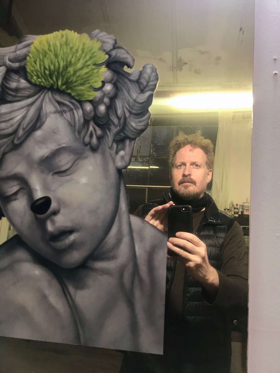 MatthewQuick's tweet photo. A rare selfie in the mix: winter, night, studio, cold, fluorescent light, oh, the glamour. 

This was with on of the selfie paintings from the A Better you series, which recently sold to a collector in Sydney. https://t.co/fWFTEIaErp