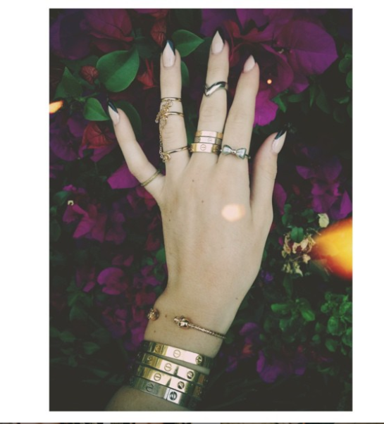 There's something she started to take to the next level with her new iPhone, editing apps and tastes: her nail selfies. The Cartier love bracelets were still there and STACKED on top of each other. Her hands looked like a supporting character in a Lana Del Rey video.