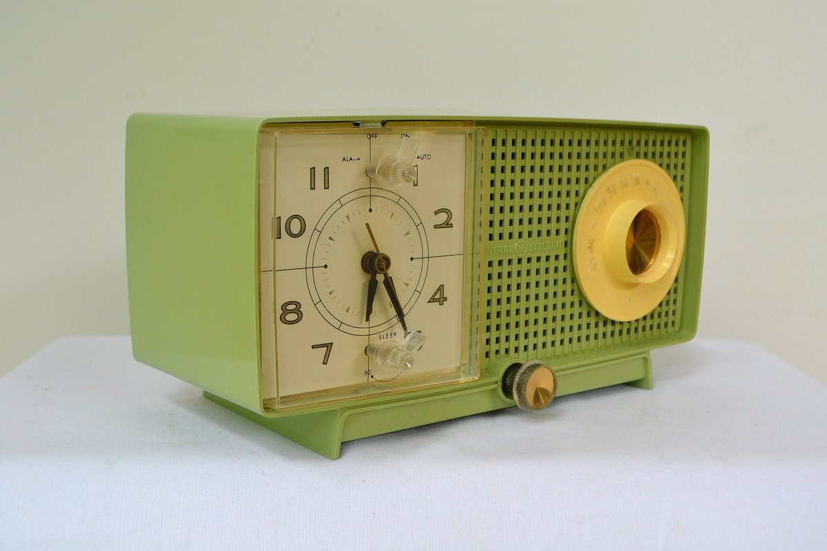 General Electric C-438B Radio Alarm Clock, 1958 (top two), & the General Electric T-129C Radio from 1959 (bottom two)