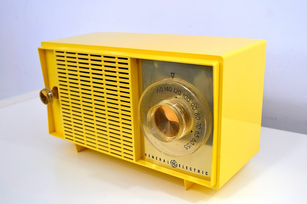 General Electric C-438B Radio Alarm Clock, 1958 (top two), & the General Electric T-129C Radio from 1959 (bottom two)