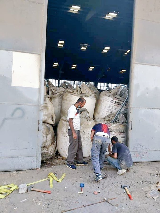 9)Reuters:“In January 2020, a judge launched an official investigation after it was discovered that Hangar 12 was unguarded, had a hole in its southern wall and one of its doors dislodged, meaning the hazardous material was at risk of being stolen.”[File Photo]