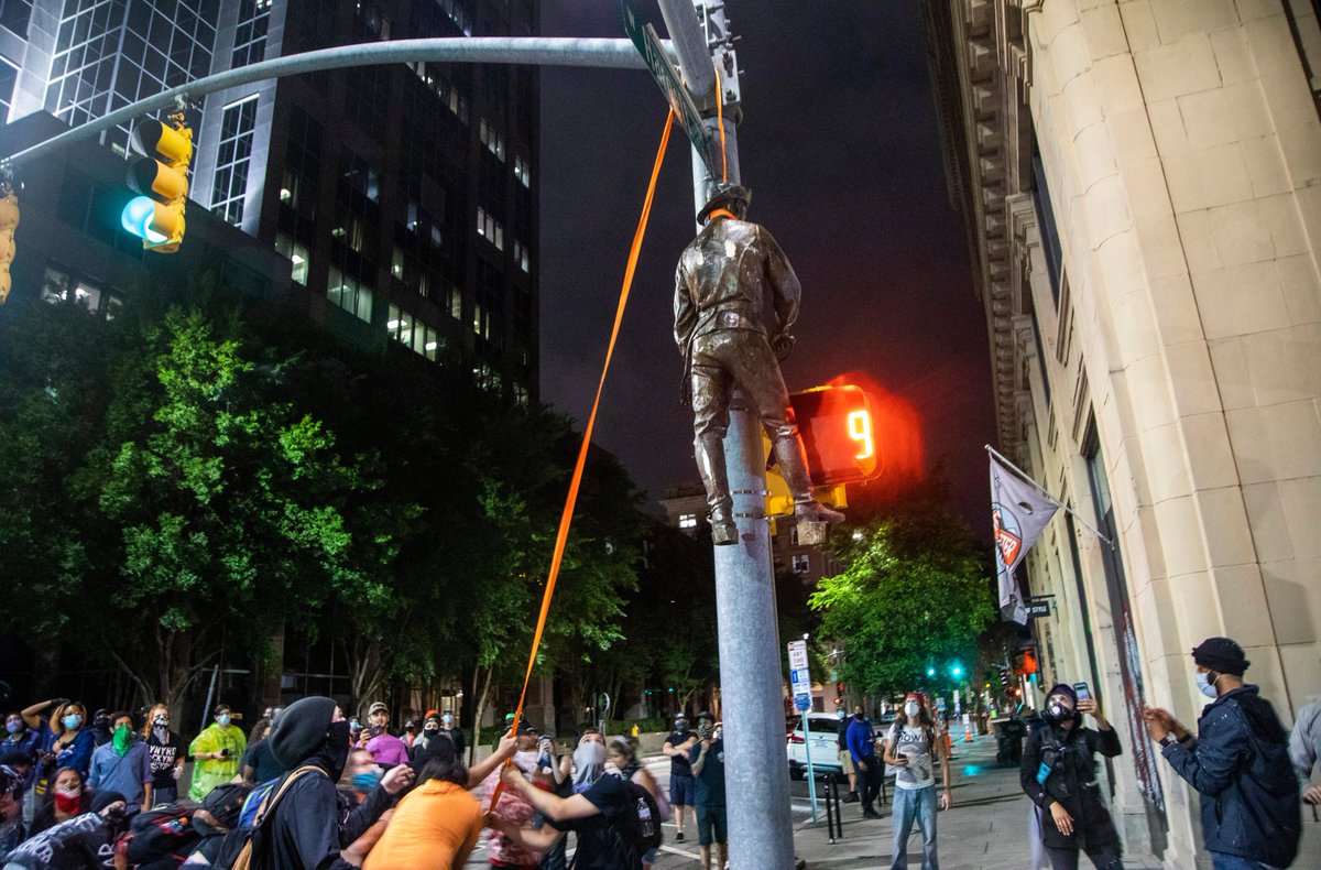 In June 2020, after demonstrations around the base of the statue, protestors removed two of its smaller figures, handing one from a stoplight and dragging the other outside the courthouse. The governor then ordered the rest of the monument dismantled and put into storage.