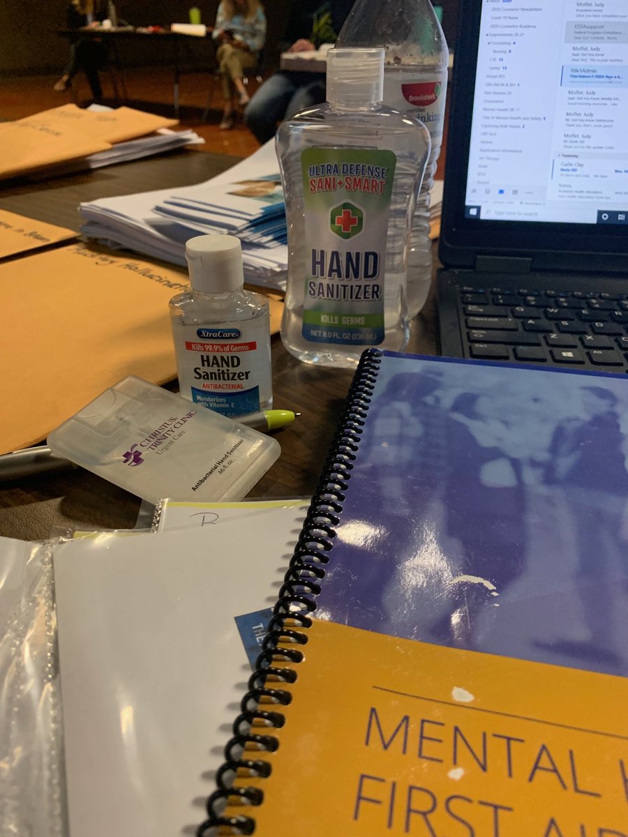 Three types of hand sanitizer within reach during the YMHFA training.