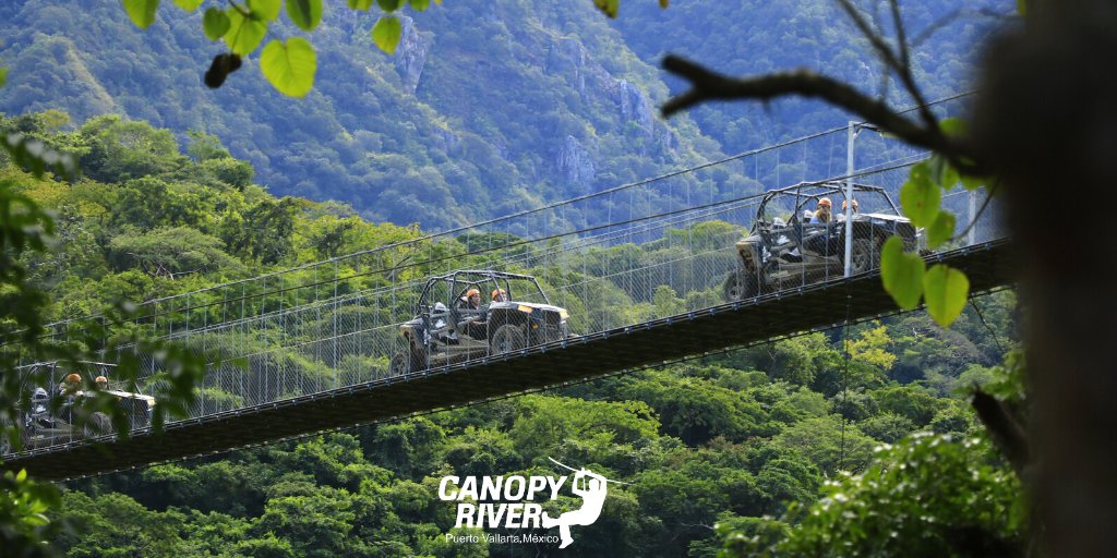 riverparkpv's tweet photo. ¿Están listos para la aventura más extrema?
¡Conduce un RZR por un puente colgante a más de 100 metros de altura, el famoso Jorullo Bridge! 😎
Reserva en nuestro sitio web:
🌐 https://t.co/qdtMFQ0QVR
#CanopyRiver #PuertoVallarta #FelizMartes https://t.co/pJdRrgQfGE