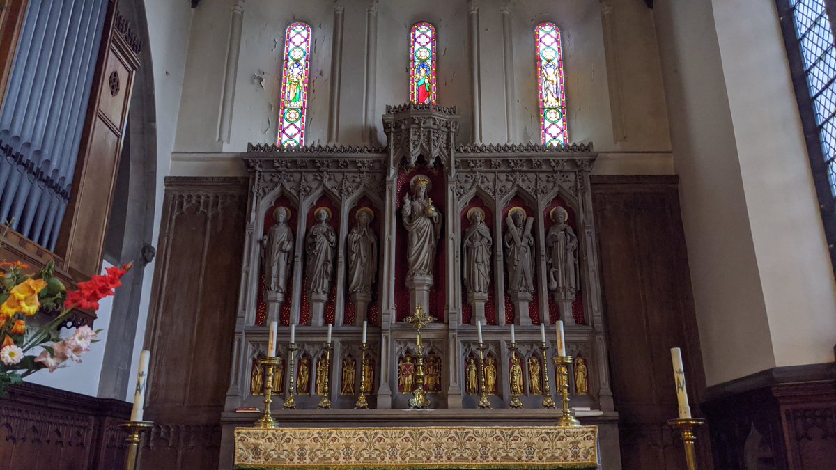 St Peter at Gowts, Lincoln, has a handsome rederos, hanging cross, war memorial, and organ loft - all Victorian or later, of course.