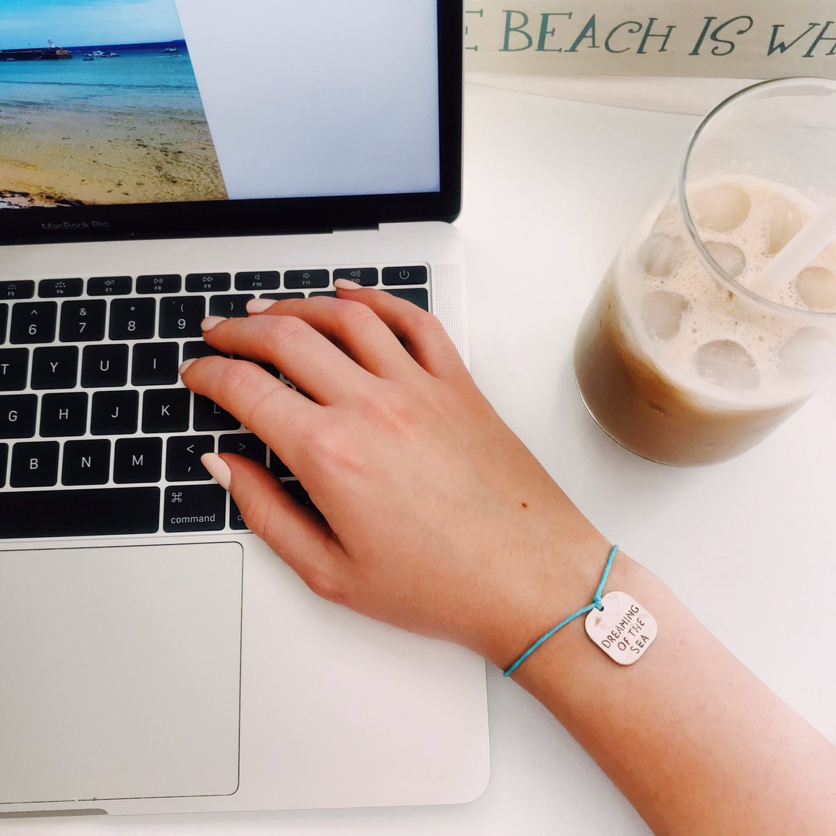 Being in the office in this sunshine calls for iced coffee and #dreamingofthesea ☀️🌊