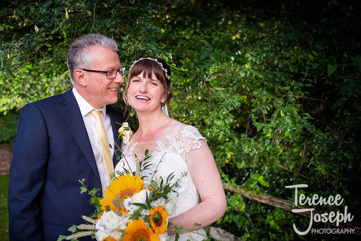 Here's a photograph of the lovely couple John and Joy. There is just something so beautiful about the sunflower theme that sums up the couple perfectly - bright, positive and full of happiness. 
<a href="/ploughatleigh/">The Plough at Leigh</a> <a href="/HelenaSergeant/">Helena Sergeant MUA</a> <a href="/SurreyKenthair/">BridalhairSurreyKent</a> <a href="/ECawseFD/">Elli Cawse</a> <a href="/IsabellaGraceB/">Isabella Bishop</a>