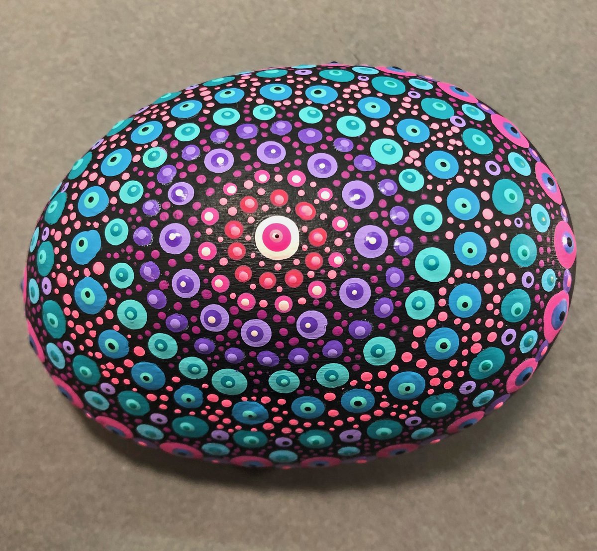 debjeans's tweet photo. I got a bit dotty today! Didn't have a perfectly round rock, it's more egg shaped. My first go at mandala style design. #rockpainting #goingdotty #anotherhobby ❤️🍷🥳 https://t.co/mzP2S1S5L7