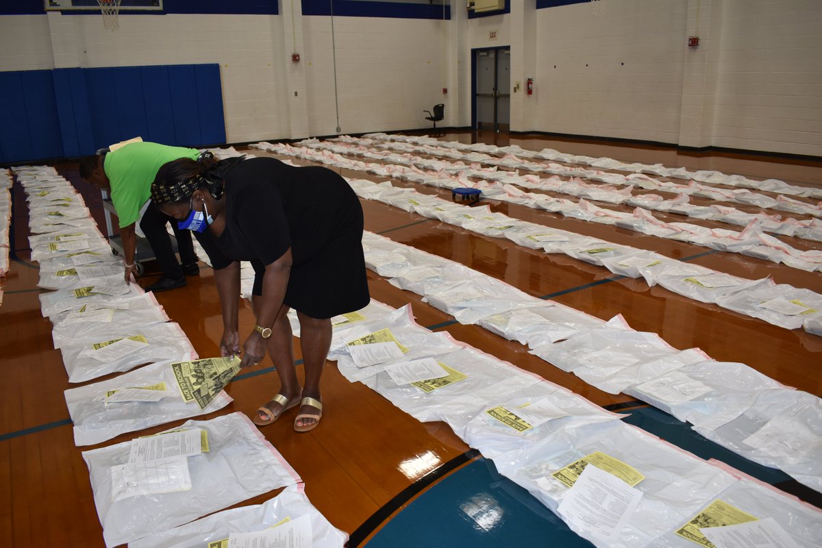 SpotsySchools's tweet photo. Check out what @chancellorms is up to!! Dr. Frazier and staff are preparing Chromebooks and packing bags full of materials to help each student be a successful virtual learner! #SCPSBackToSchool #SpotsySchools https://t.co/MFGljrEjLp