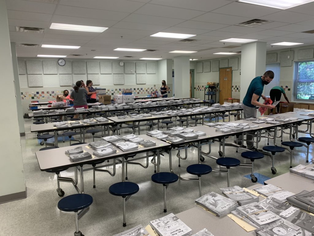 ChelseaEttere's tweet photo. Day #2 of packing books and supplies for our kiddos! Grateful for our wonderful @WoodburnES staff who has been coming in to stuff and alphabetize bags. @FCPSR2 https://t.co/AEOSe2wUiI