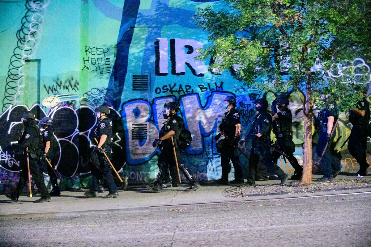On previous nights, SPD had generally follows the march about a block back. Clearing road obstructions after protestors moved on. Photos here from last week.