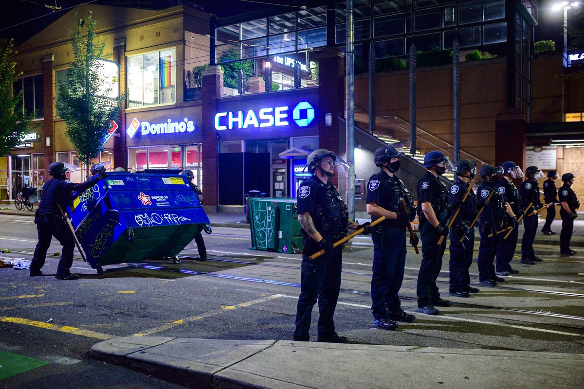 On previous nights, SPD had generally follows the march about a block back. Clearing road obstructions after protestors moved on. Photos here from last week.