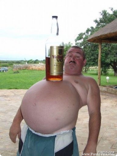 6 - this guy has a large stomach and is balancing a bottle of liquor upon it