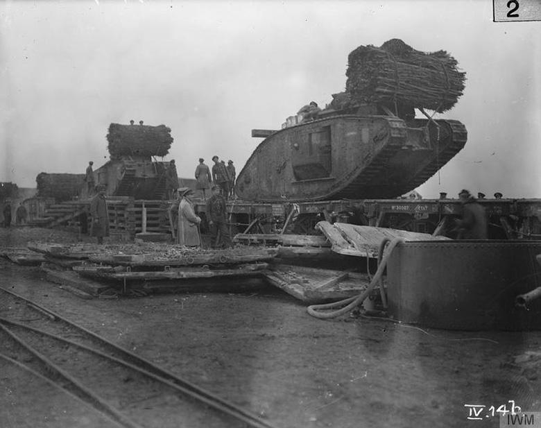 A mark IV tank with a facine. The facines were a bundle of wood designed to fill in Trenches to allow the Tank to pass over. With mixed success.